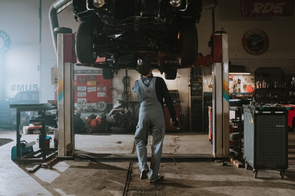 Mechanic fixing car overdue for a service
