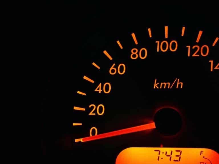 Car dashboard displaying 0km