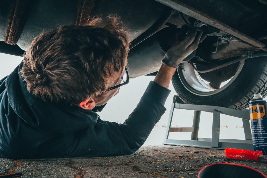 Sunshine Coast mechanic servicing under car