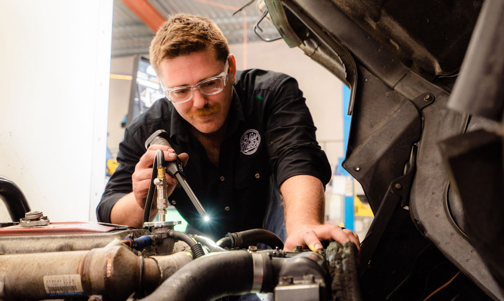 Mechanic Checking Car Engine